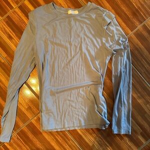 Long sleeve light blue top with shoulder detail size medium